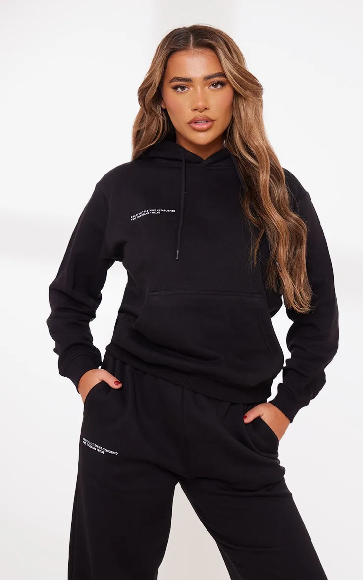 PRETTYLITTLETHING Hoodie oversize noir à slogan Est 2012